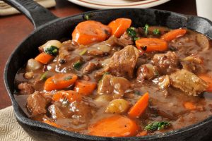 A beautiful skillet of Beef Bourguignon, made with amazing wine. A traditional french classic!