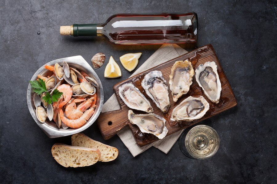 Pairing Wine with an amazing seafood meal including oysters, shrimp and other offerings.